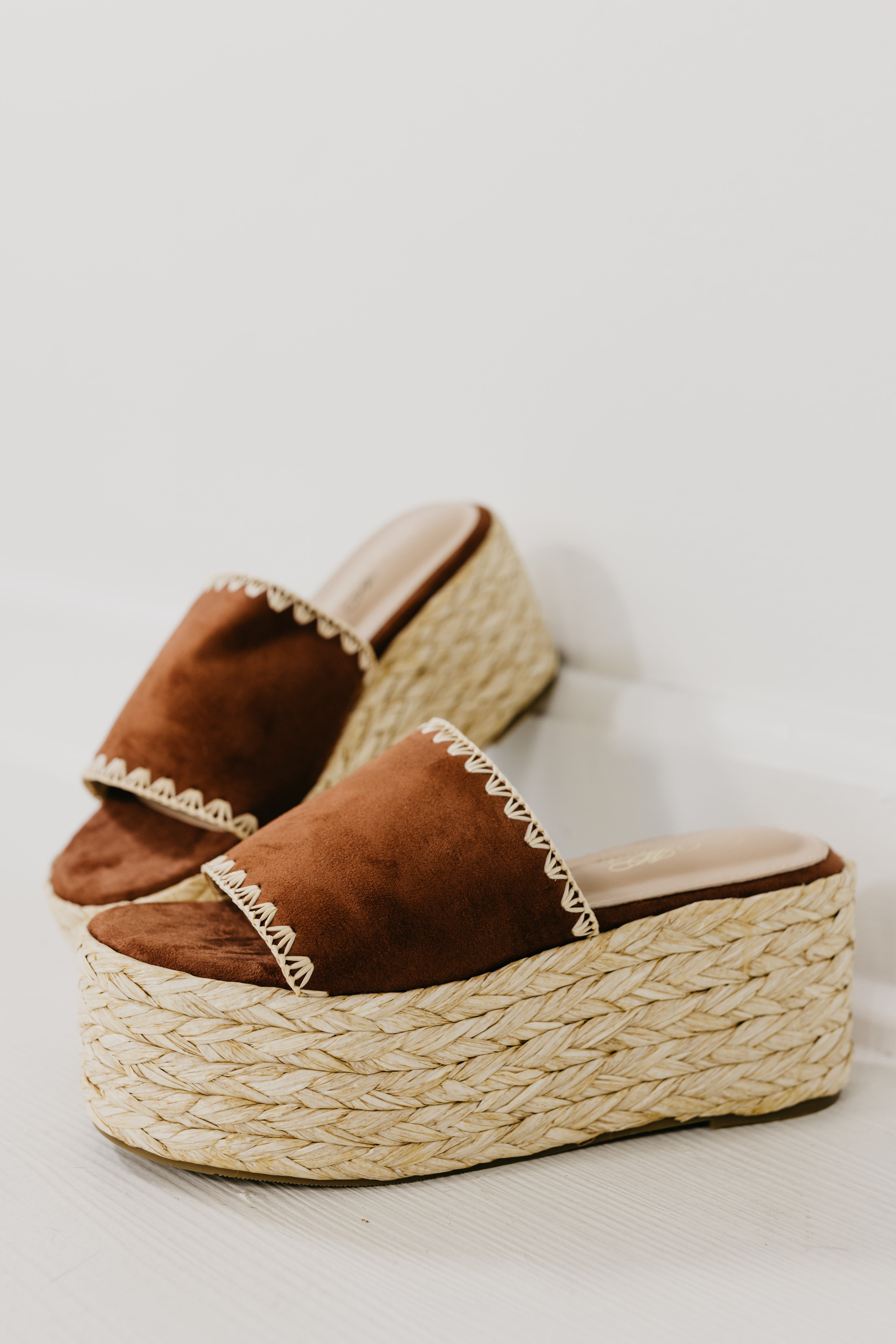 The Gemini Raffia Stitch Platform Sandal