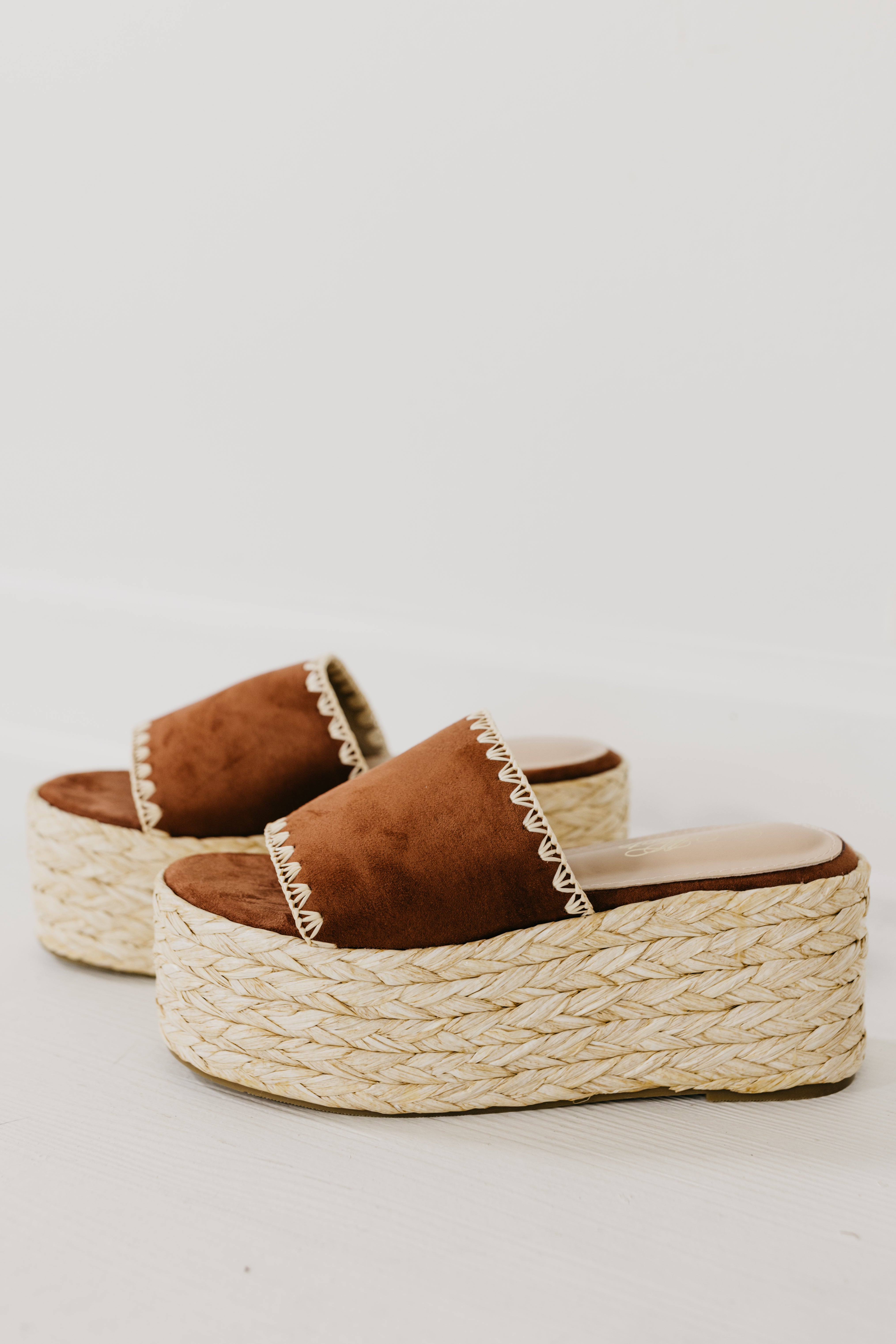 The Gemini Raffia Stitch Platform Sandal